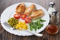 Fried turkey meat with vegetables in dish, salt, pepper, ketchup Royalty Free Stock Photo