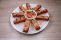 Fried Veg. spring rolls in white dish with vegetables on the dark wooden background or Selective focus image Royalty Free Stock Photo