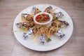 Fried Veg. spring rolls in white dish with vegetables on the dark wooden background or Selective focus image Royalty Free Stock Photo