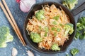 Fried vegan rice noodles with tofu and broccoli Royalty Free Stock Photo