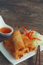 Fried vegetable spring rolls with fresh ingredients served with sweet chili sauce. Royalty Free Stock Photo