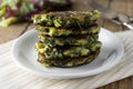 Fried vegetarian broccoli and spinach fritties, for burgers on a wooden table. Vegetarian and healthy food