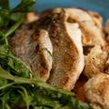 Fried white fish with greens. Close up shot. Food concept. Square format or 1x1 for posting on social media. Soft focus