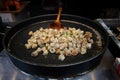 Fried wontons are prepared at food stall, Qibao village, Shanghai