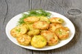 Fried zucchini with dill