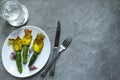 Fried Zucchini Flowers Stuffed with cream cheese with garlic on white plate. Copy space Royalty Free Stock Photo