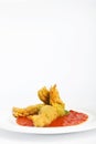 Fried zucchini flowers stuffed with ricotta and ham