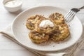 Fried zucchini slices in egg batter with garlic on a plate. Royalty Free Stock Photo