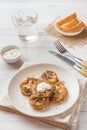 Fried zucchini slices in egg batter with garlic on a plate. Royalty Free Stock Photo