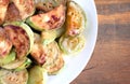 Fried zucchini slices on wooden background Royalty Free Stock Photo