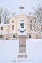 Friedrich Robert Faehlmann statue in front of the old Anatomical Theatre in the snow in Tartu