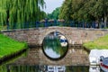 Friedrichstadt, Germany - September 06, 2021: Mittelburggraben in Friedrichstadt. Historic stone bridge over the canal in