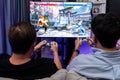 Friend gamers playing video game of battle martial arts fighter. Sellable.