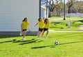 Friend girls teens playing football soccer in a park Royalty Free Stock Photo