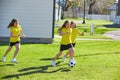 Friend girls teens playing football soccer in a park Royalty Free Stock Photo