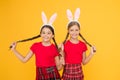 With friend. happy easter. spring is coming. happy childhood concept. small girls bunny ears yellow background. funny Royalty Free Stock Photo