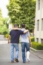Friend helping brothers or patient to walk without crutches Royalty Free Stock Photo