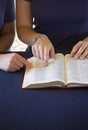 Friend Helping Someone Study the Bible Royalty Free Stock Photo