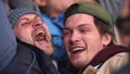 Friend joy game hockey score win closeup fan emotion scream crowd stadium 4K. Royalty Free Stock Photo