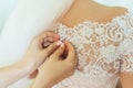 The friend-witness of the bride helps to dress bridal dress bride Royalty Free Stock Photo