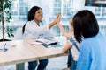 Friendly African American pediatrician woman doctor giving five to little girl patient, celebrating good medical checkup Royalty Free Stock Photo