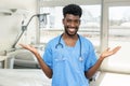 Friendly african american young doctor or male nurse at hospital room Royalty Free Stock Photo