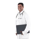 Friendly Afro-American doctor working on a laptop wearing scrubs. Isolated on a white background. Royalty Free Stock Photo