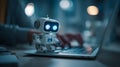 Friendly AI robot observing typing hands, reflecting human-machine teamwork, digital assistance, and advanced technology in Royalty Free Stock Photo