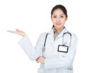 Friendly Asian doctor woman introduce something