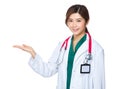 Friendly Asian doctor woman introduce something