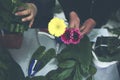 Friendly Asian florist or Saleswoman in a flower shop