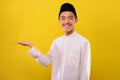 Friendly of Asian Muslim man presenting copy space or showing something Royalty Free Stock Photo