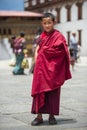 Friendly Bhutanese young Buddhism monk in Dzong , Thimphu , Bhutan Royalty Free Stock Photo