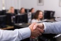 Friendly boss greeting new colleague