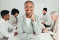 A friendly boss. a young businesswoman standing in a meeting at work.