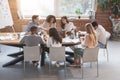 Friendly business team sitting around table, having meeting Royalty Free Stock Photo