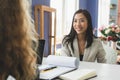 Friendly business woman interviewing new applicant candidate for marketing team staff for her team in the meeting room Royalty Free Stock Photo