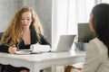 Friendly business woman interviewing new applicant candidate for marketing team staff for her team in the meeting room Royalty Free Stock Photo