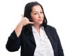 Friendly businesswoman making phone call gesture with fingers Royalty Free Stock Photo