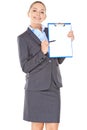Friendly businesswoman pointing to a clipboard