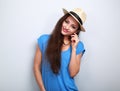 Friendly casual woman in hat looking happy