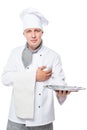 Friendly chef with a tray on his hand posing on a white