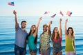 Friendly company waving the American flag. Royalty Free Stock Photo