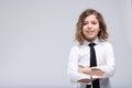 Friendly confident young schoolgirl in uniform