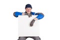 Friendly construction worker holding a blank, white sign. Isolated on white Royalty Free Stock Photo