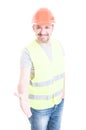 Friendly construction worker smiling and doing a hand shake gesture Royalty Free Stock Photo