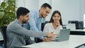 Friendly creative diverse colleagues team discuss online project use computer at workplace, multiracial coworkers group Royalty Free Stock Photo