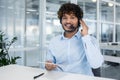 Friendly customer service agent working with headset in office Royalty Free Stock Photo