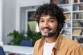 Friendly customer service representative with headset smiling in office Royalty Free Stock Photo