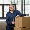 Friendly delivery woman in uniform